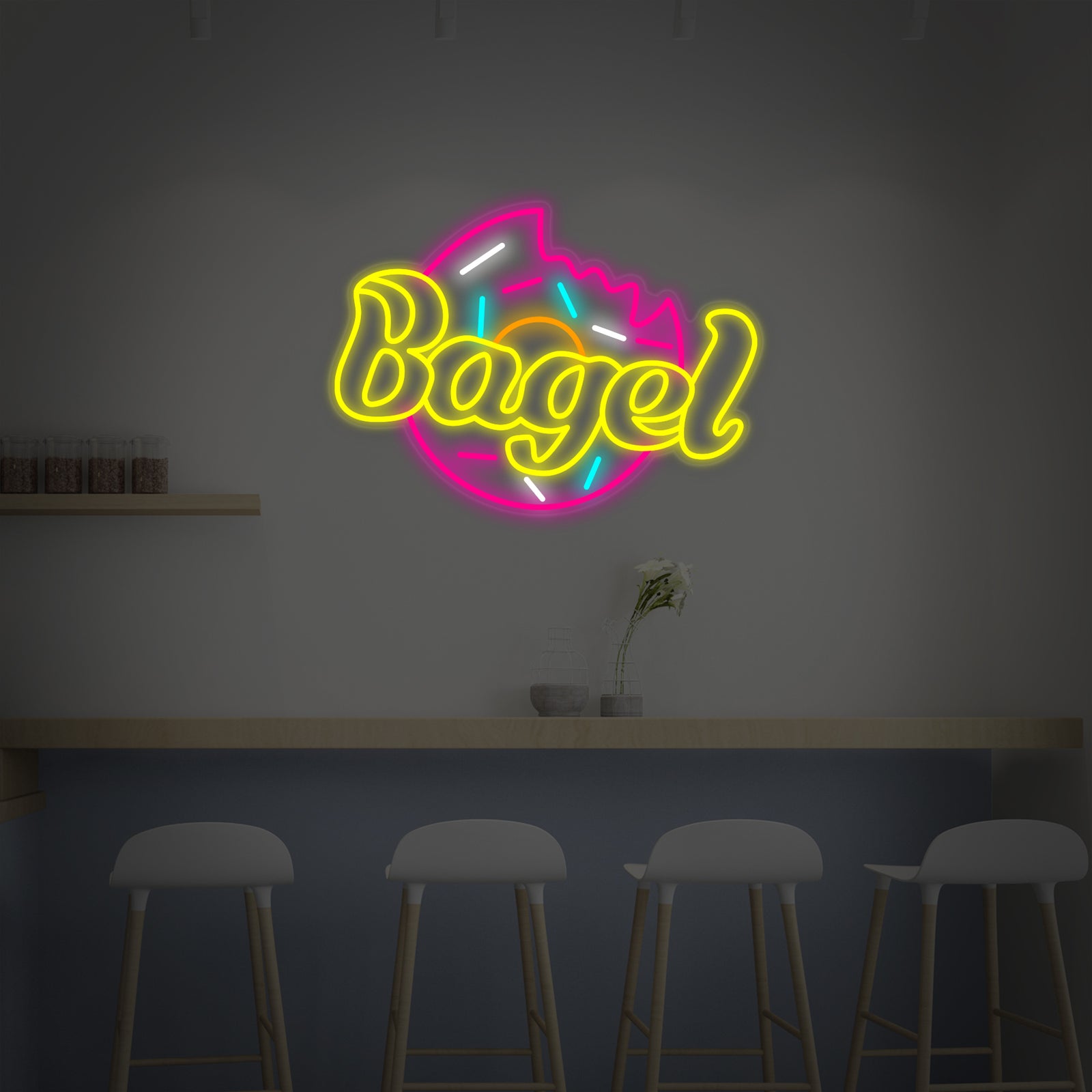 A graphic design mockup of a hand-bent neon sign spelling out 'BAGEL' with a stylistic bagel icon above it, showing potential mounting on a dark background.