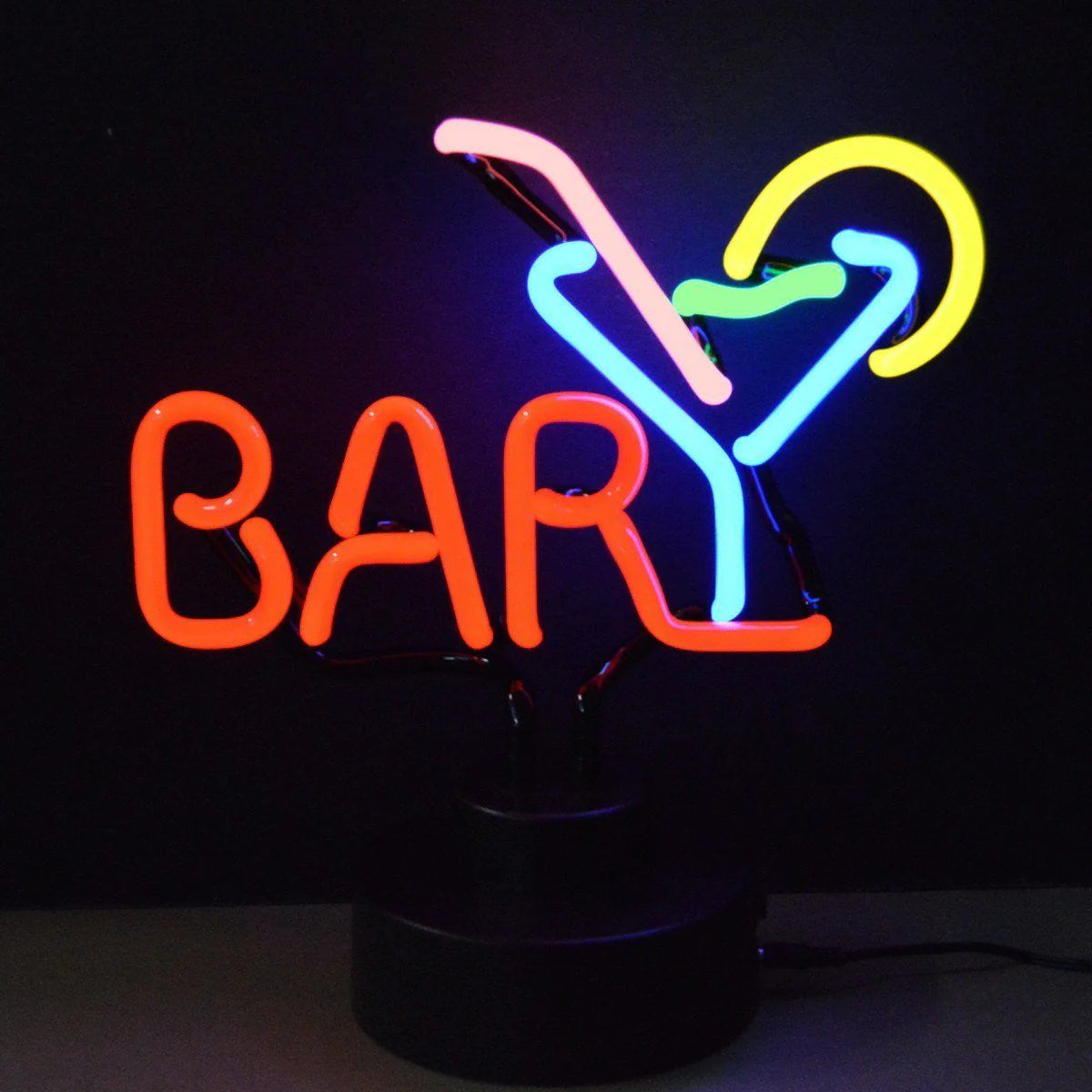Tabletop neon sign in the shape of a martini glass with glowing orange and blue glass tubing on a black base.