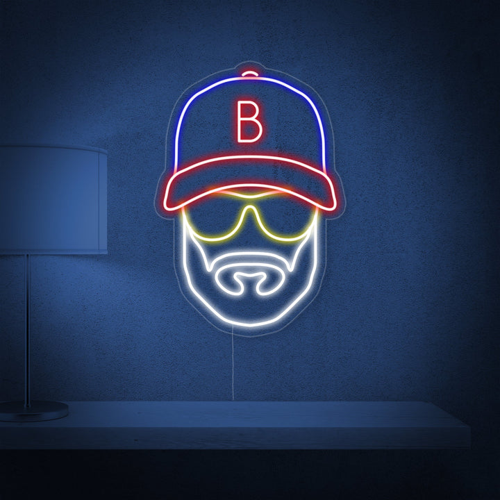 Detailed shot of the Baseball Man with Hat neon sign glowing white against a textured background.