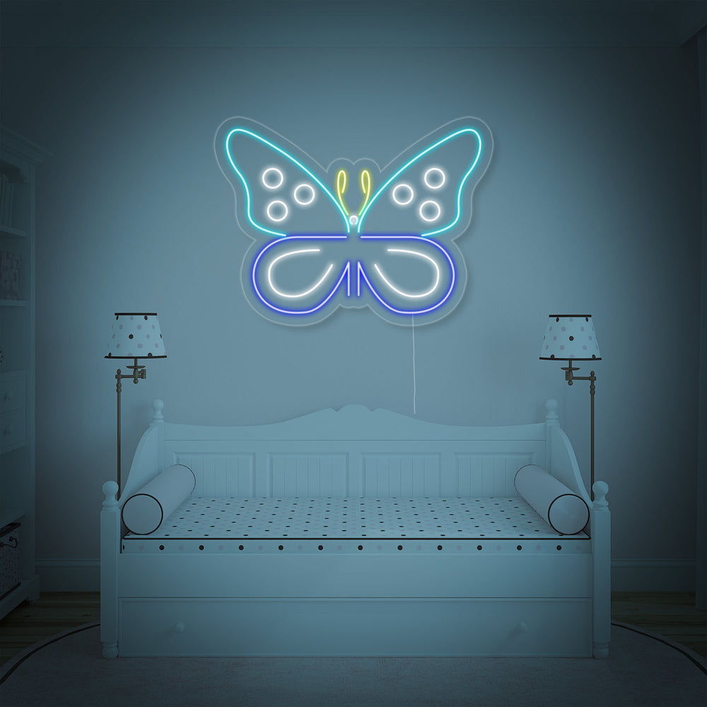 Close-up view of the glowing blue butterfly neon sign showing its detailed design.
