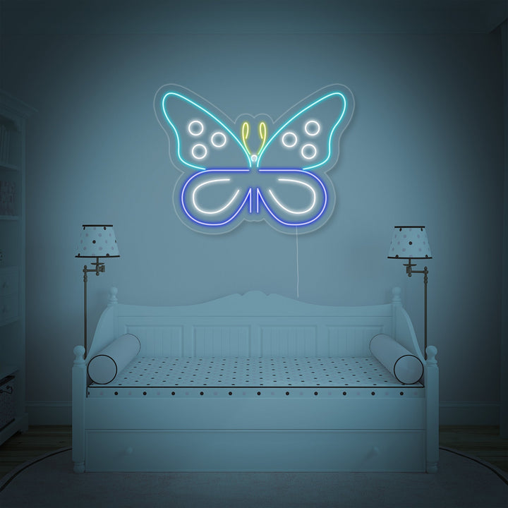 Close-up view of the glowing blue butterfly neon sign showing its detailed design.