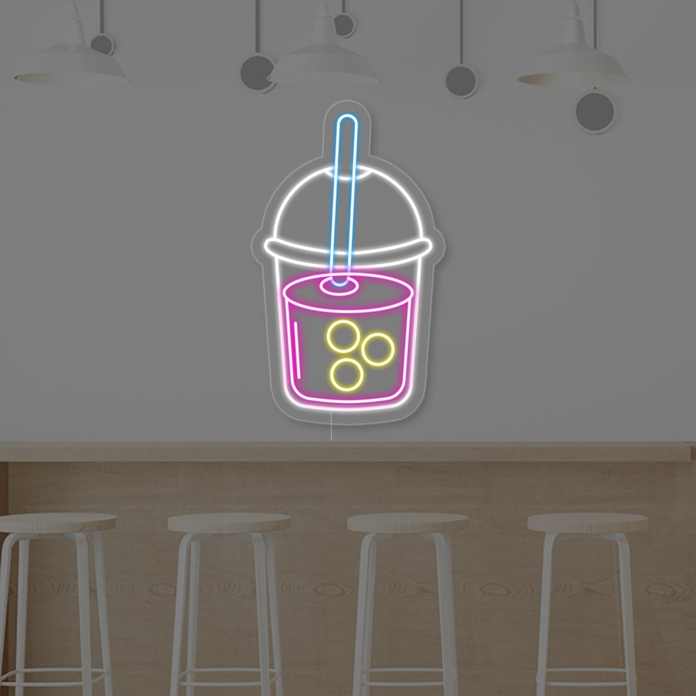 A closer look at the intricate details and vibrant, glowing light of the 'Boba Tea Cup' neon sign, emphasizing its fun, playful design.