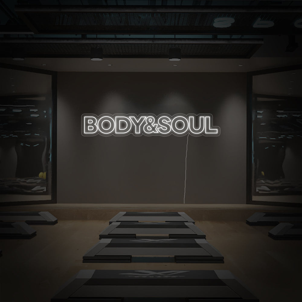 The glowing 'Body and Soul' neon sign design featuring a clear backing and power cord detail on a dark background.