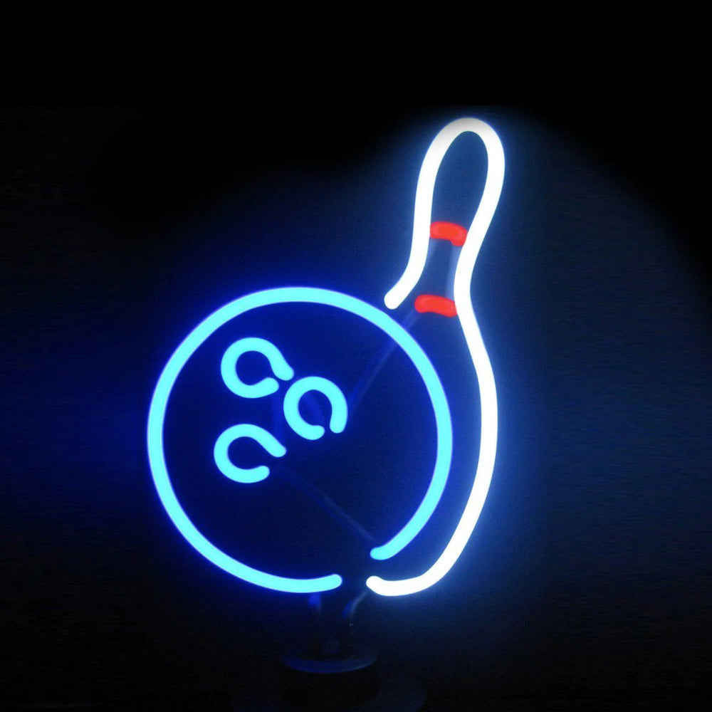 Close-up photograph of a red and white 'Bowling' neon sign with a bowling ball and pins glowing against a dark, textured brick wall.