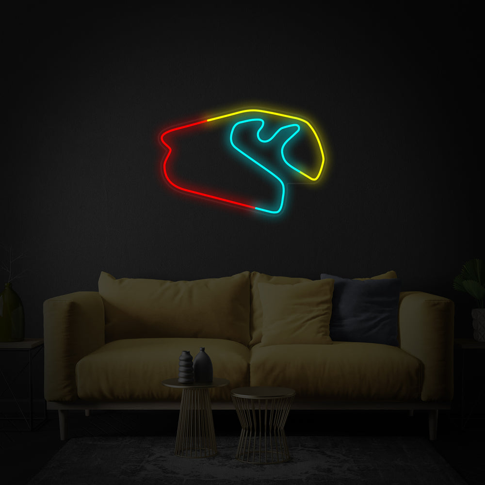 Close-up of the Brazilian F1 Race neon sign design on a blue wall, showing the detailed tubing.