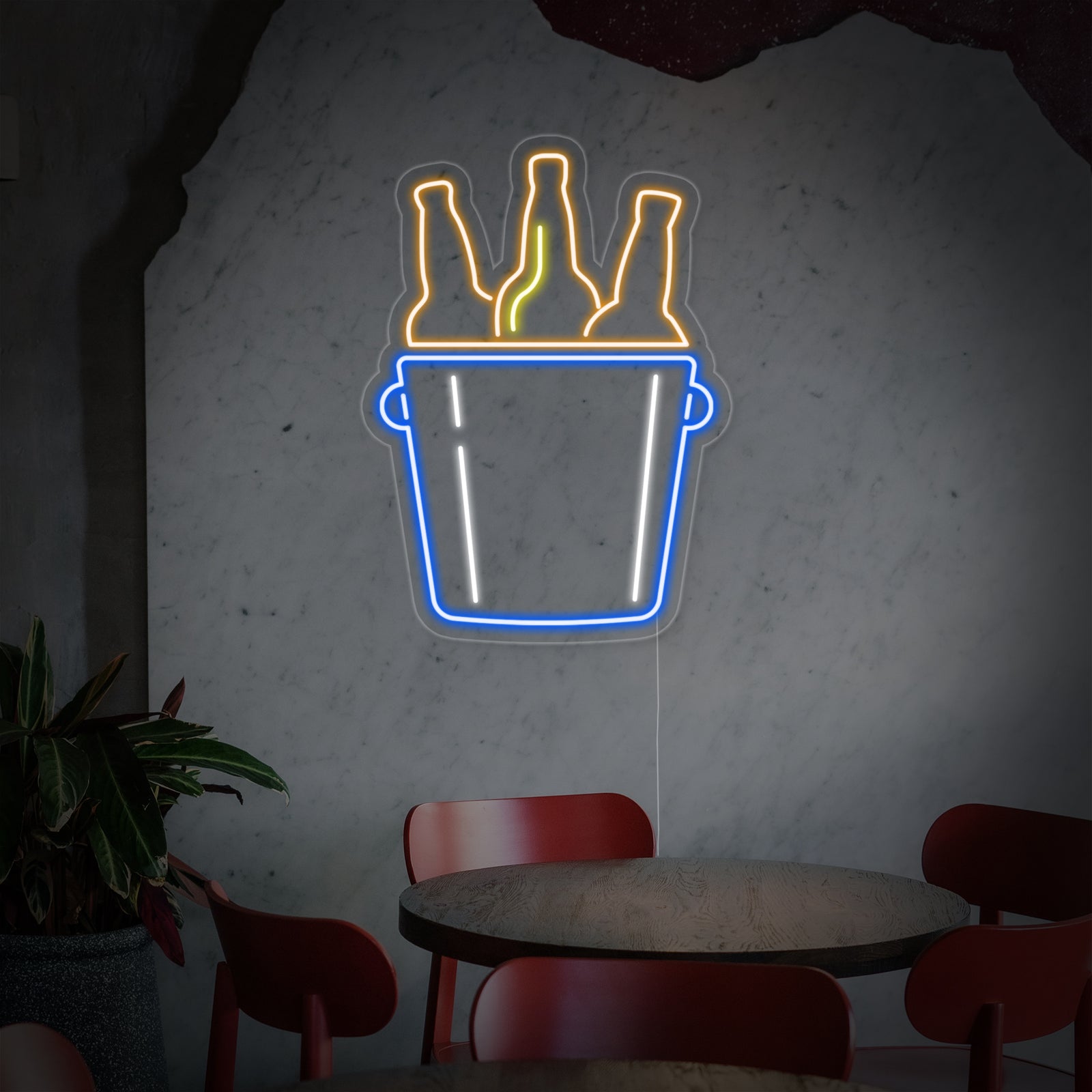 The graphic design illustration of a 'Bucket of Beers' neon sign, showing the yellow ice bucket and four bottled beers in a red oval frame.