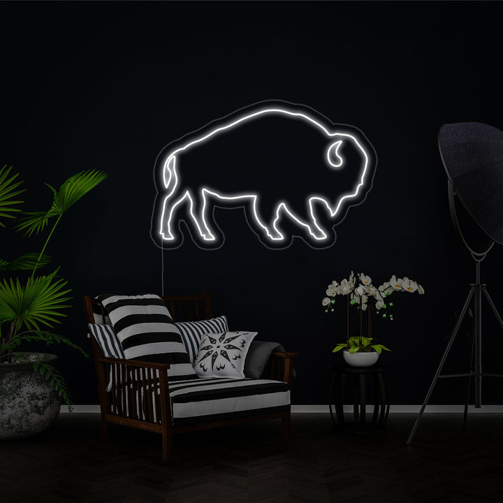 A straightforward product view of the Buffalo neon sign, clearly showing the red glowing tubes that form the animal silhouette, mounted on a transparent acrylic backing with a black electrical wire.
