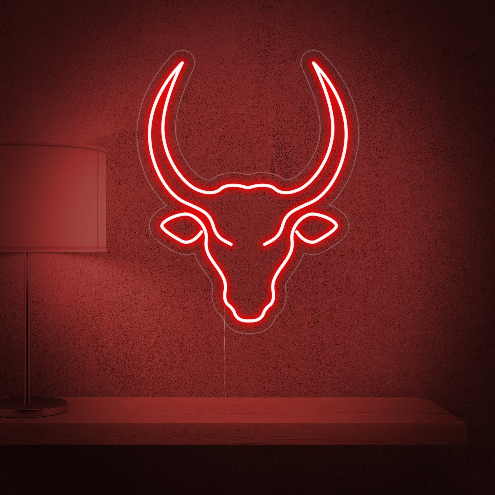 A close-up view of the 'Bull Skull Cow' neon sign design, featuring glowing tubes forming the shape of a bull's head.