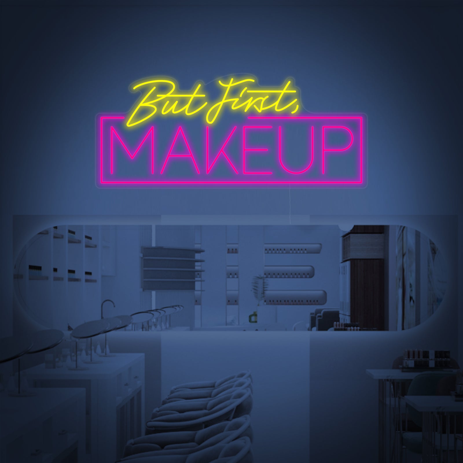 Handmade 'But First Makeup' script neon sign glowing pink, mounted on an acrylic backboard against a dark grey brick wall.