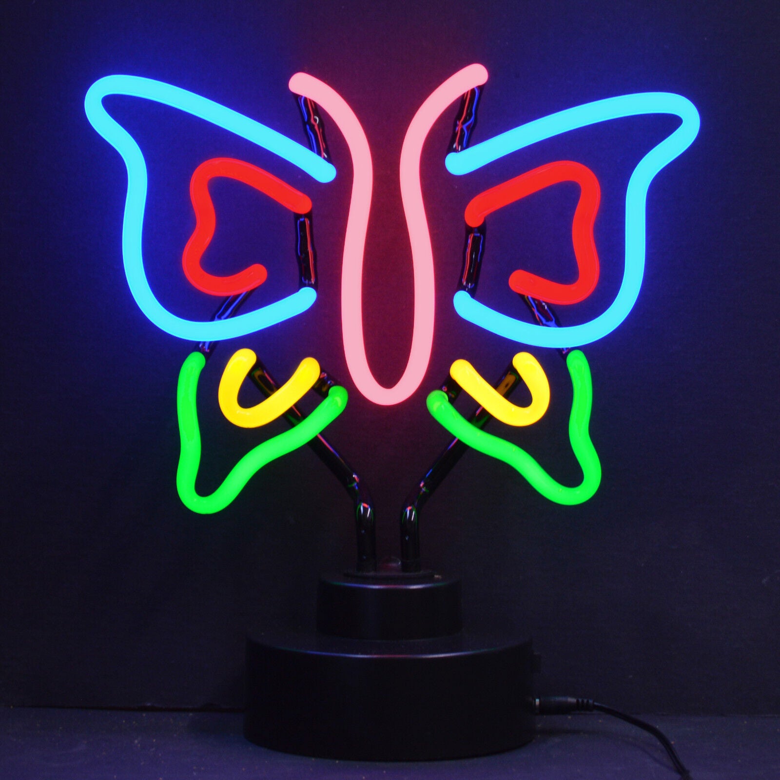 A vibrant orange 'Butterfly' table neon sign with visible glass tubes and black cylindrical base, glowing in a modern room setting