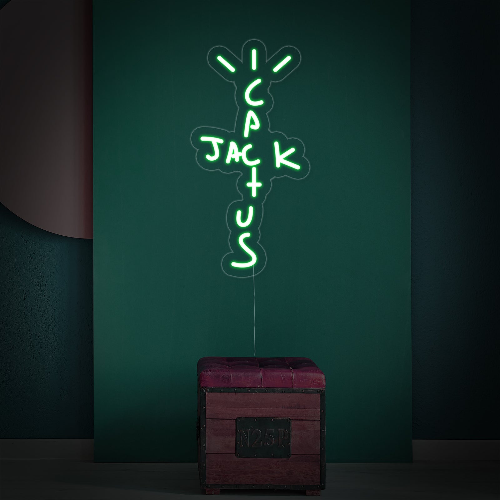 Closeup of the clear acrylic backing and glowing orange tubes on a Cactus Jack neon sign.