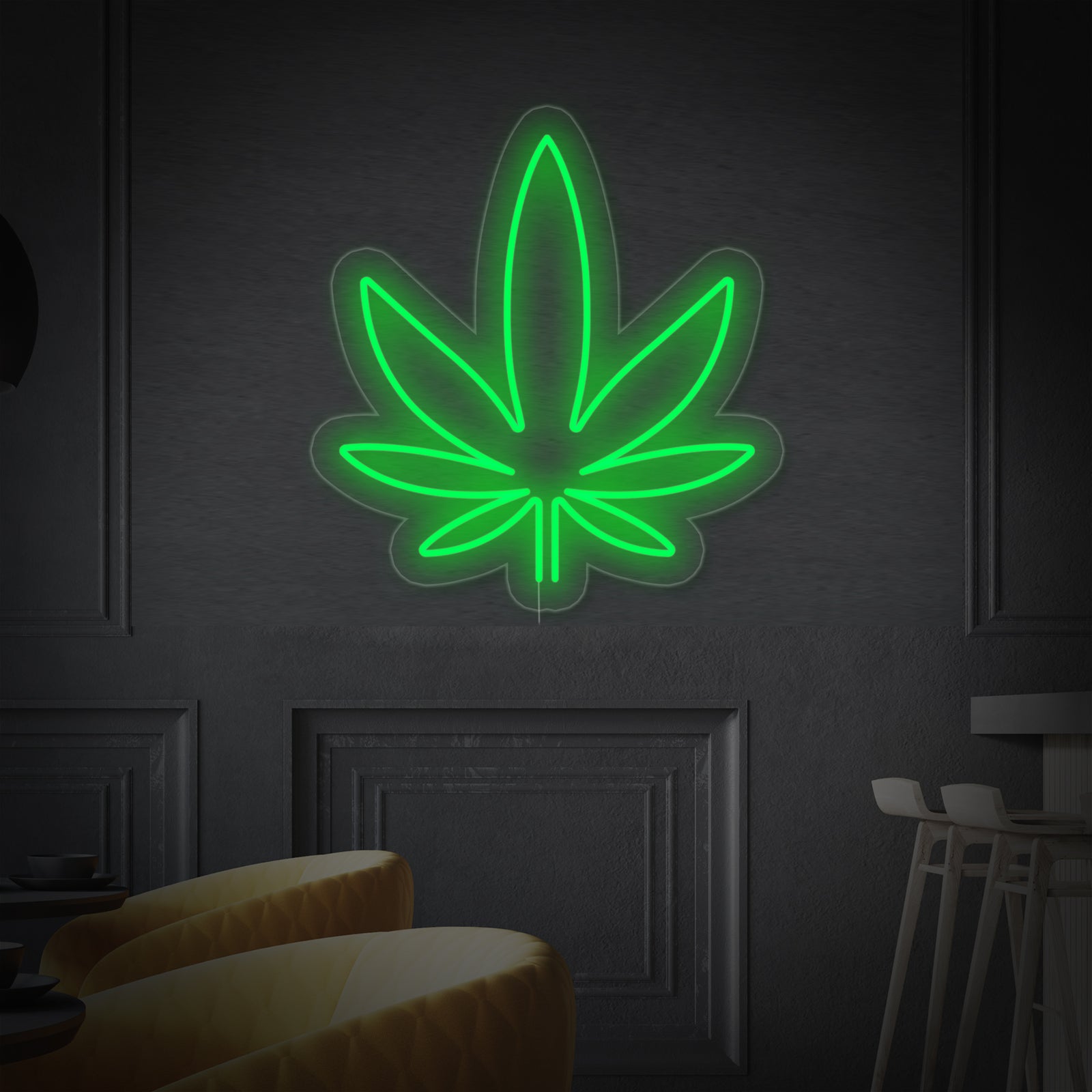 Detailed product view of the green marijuana neon sign showing the backing and neat lighting tubes against an out-of-focus background.