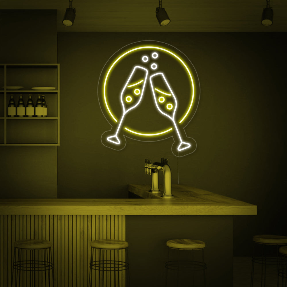 Detailed product view of the Champagne Glasses Cheers neon sign, showing the glowing tubes mounted on a clear acrylic backing.