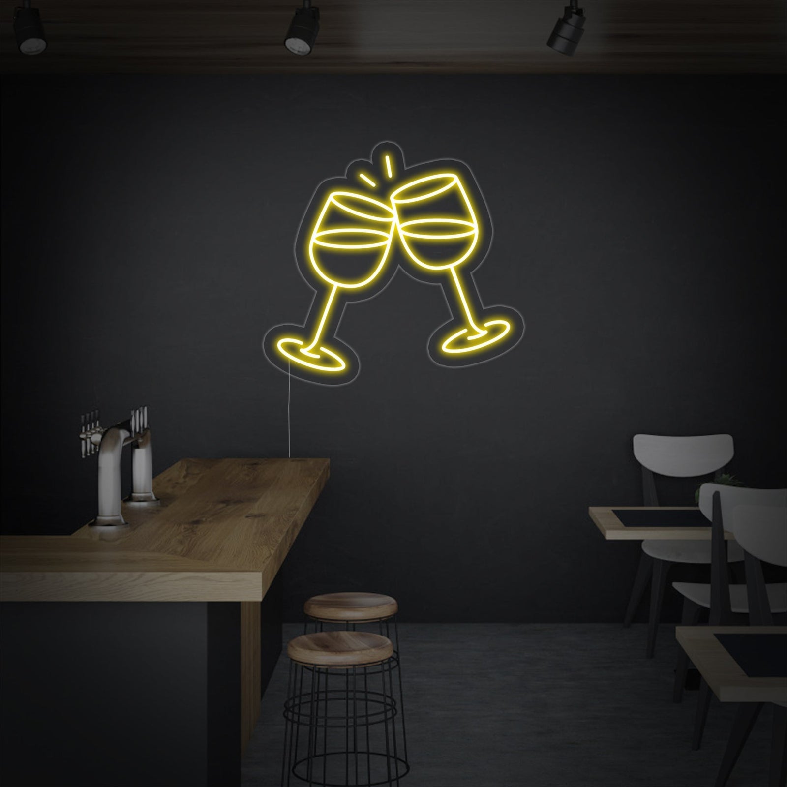 Close-up mockup of a 'Champagne Glasses' neon sign with clear acrylic backing, showing the glowing lines and mounting wire against a stylized grey wall.