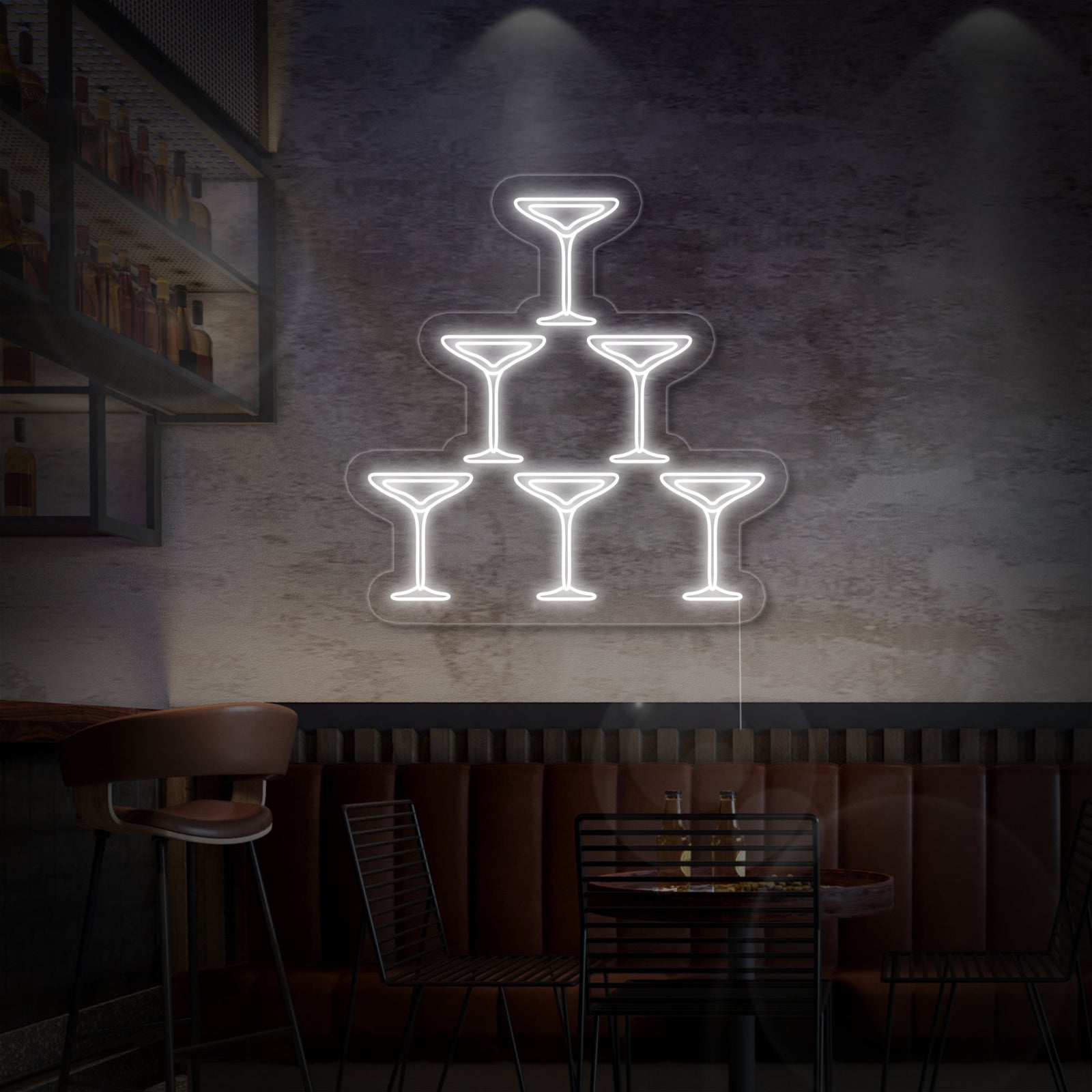 A vibrant 'Champagne Glasses' neon sign glowing on a textured brick wall above a well-stocked bar counter, illuminating bottles and glassware with a warm, celebratory light.