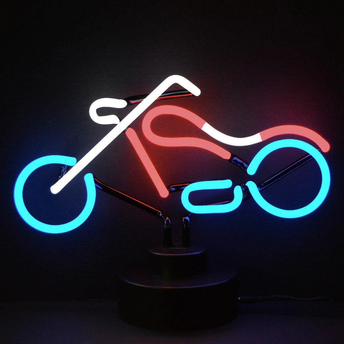 Authentic neon sign in the shape of a classic chopper motorcycle on a table base, glowing in a dim room.