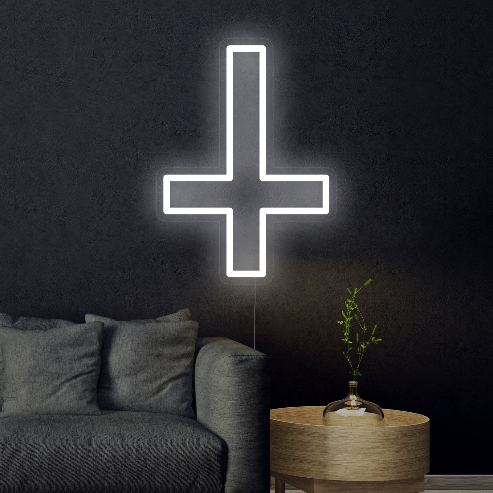 Close-up detail of the glowing Saint Peter cross neon sign mounted on clear acrylic with visible hardware
