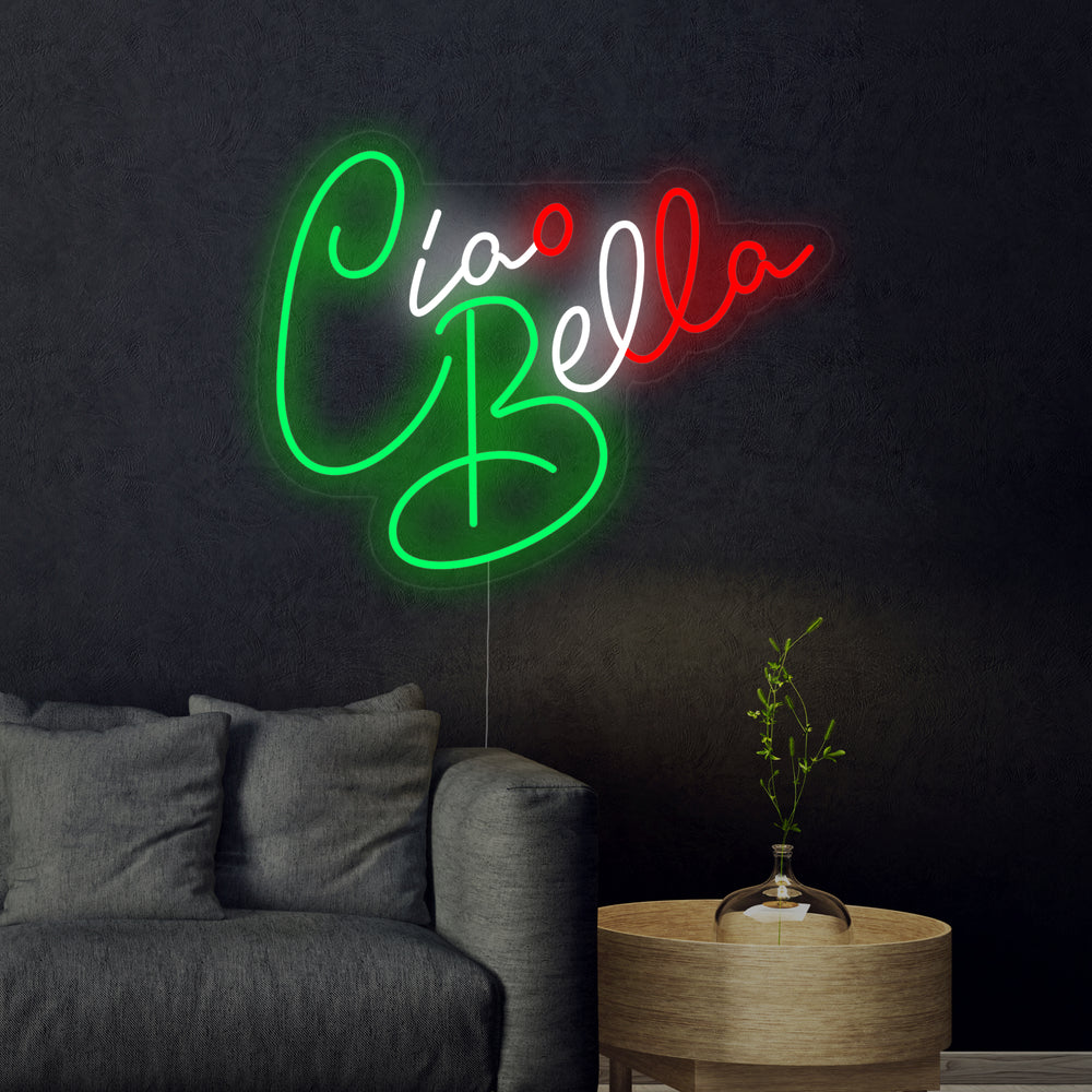 Close-up photograph of the Ciao Bella Hello Beautiful neon sign against a dark, slightly reflective surface, showcasing the detailed craftsmanship of the white and blue glowing script.