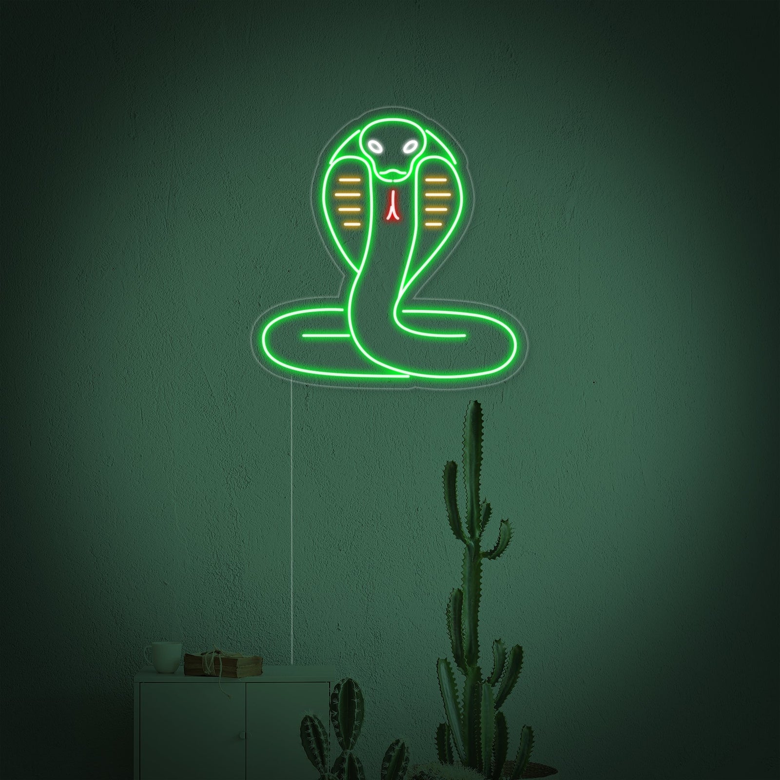 The glowing red neon outline of a coiled cobra snake with its hood flared, mounted on a transparent acrylic backing plate.