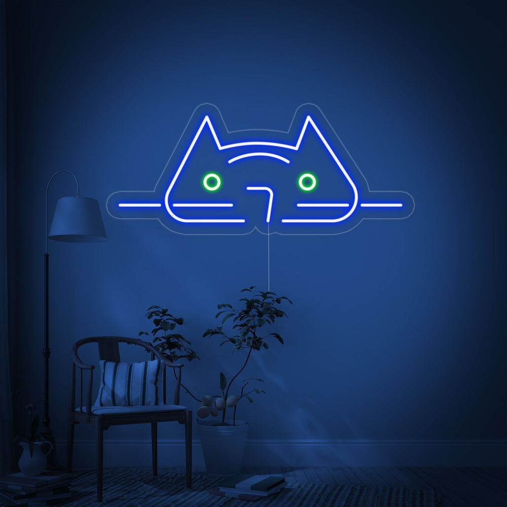 A glowing blue 'Cool Cat' neon sign, mounted on a clear backer, shown against a simple, textured background.