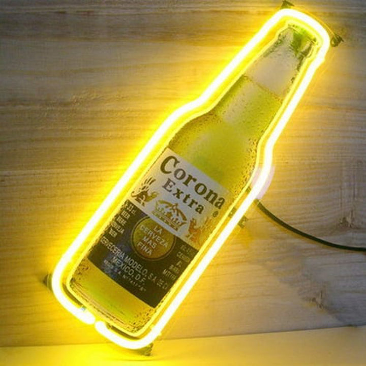 A realistic photograph of the fabricated neon sign on a natural wood surface, showing the power cord, adapter, and the clear outlines of the blue, white, and orange neon tubing. Note the wall mounting bracket on the left.