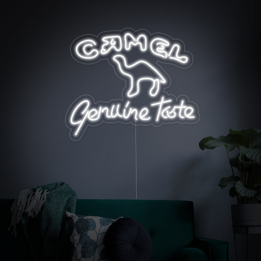 A studio product image of the camel logo neon sign against a plain dark wall, showcasing its bright glow and clear acrylic mounting.