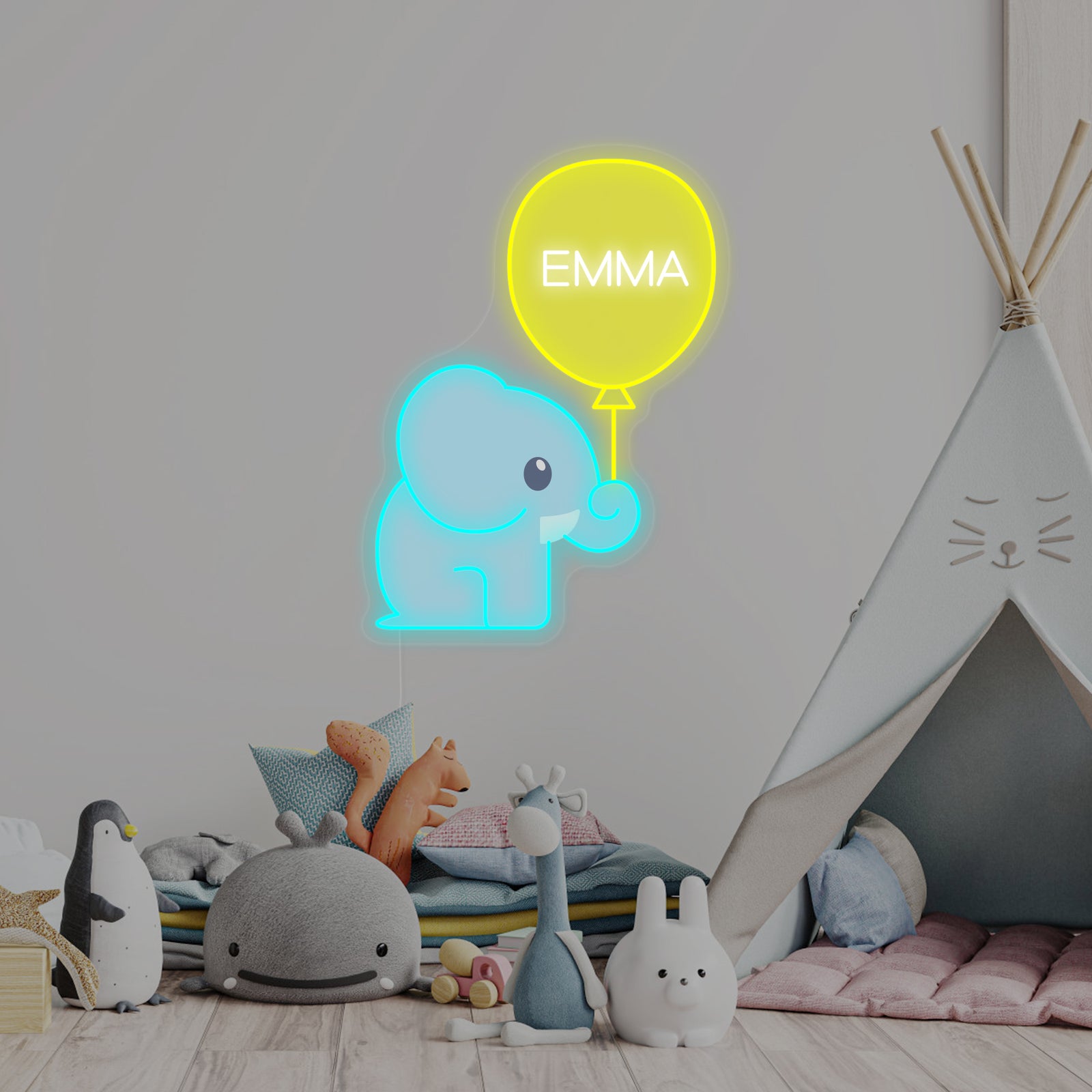 A custom name neon sign with a cute blue elephant holding a pink balloon, mounted on a white wall in a cozy nursery setting.