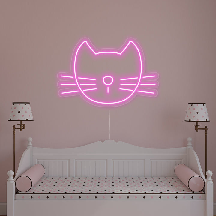 A glowing pink cat neon wall sign, depicted against a blurred interior wall background, showcasing its vibrant and detailed design.