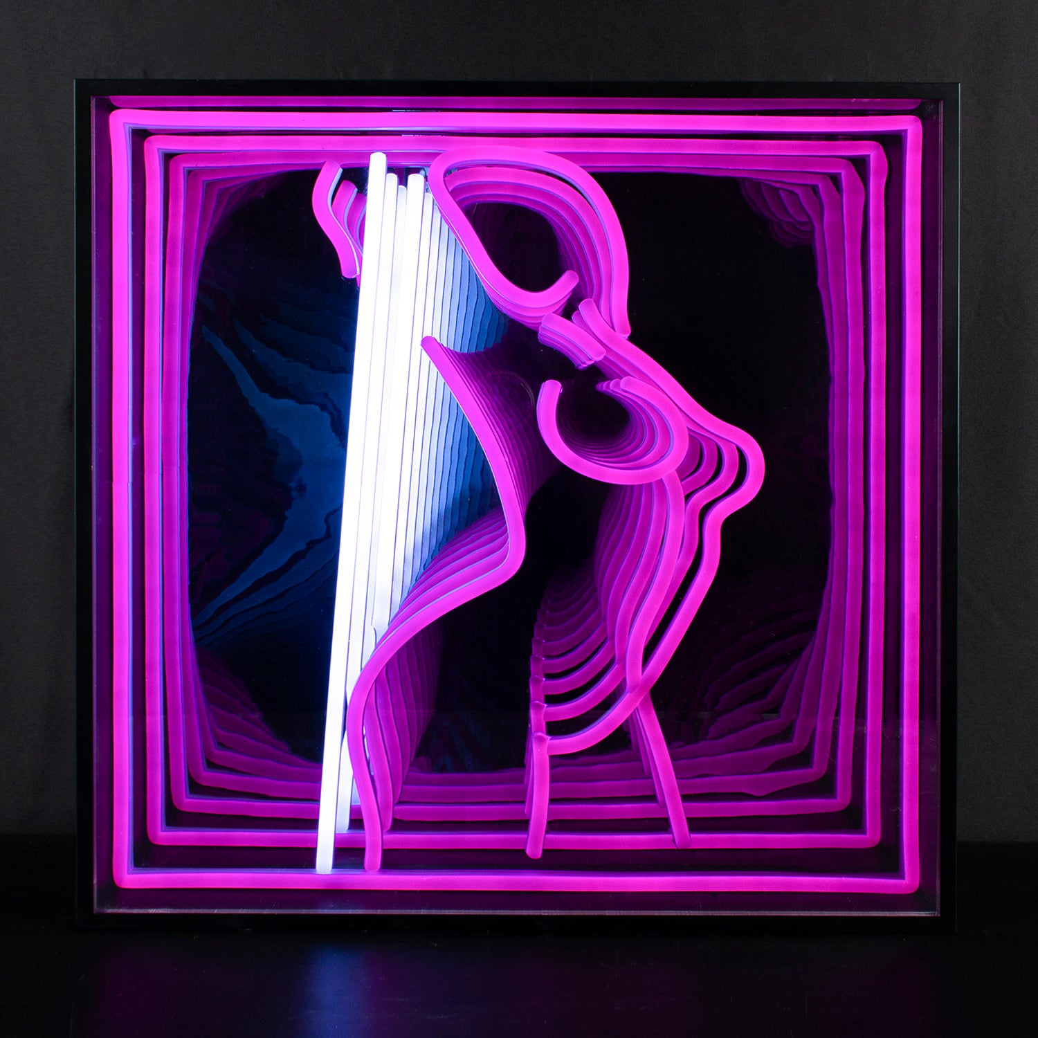 Dancing Girl 3D Infinity Neon Sign glowing brightly in a dark room, showing the hypnotic tunnel effect created by the infinity mirror and glowing silhouette.