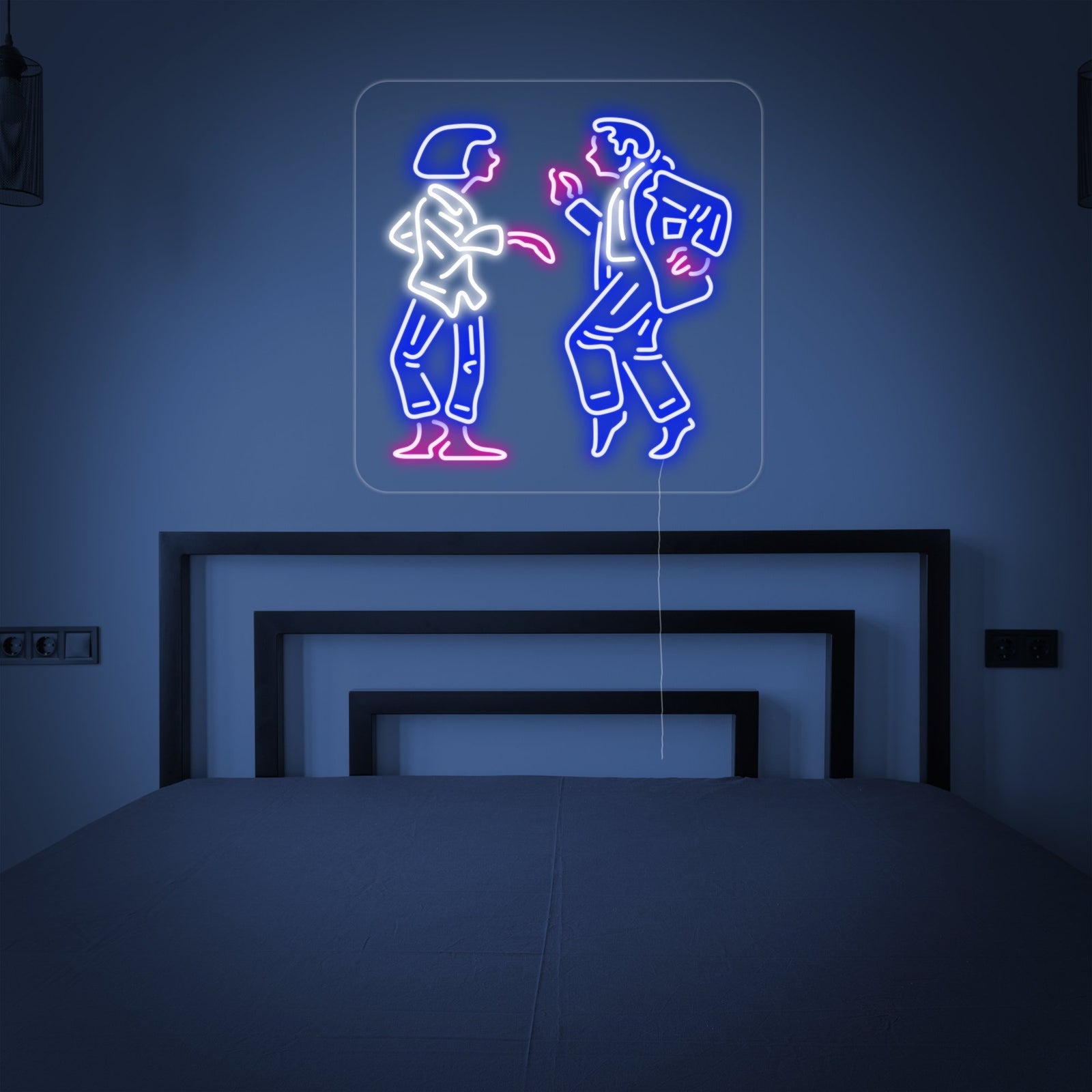 Dancing Couple neon sign glowing above a bed in a bedroom setting