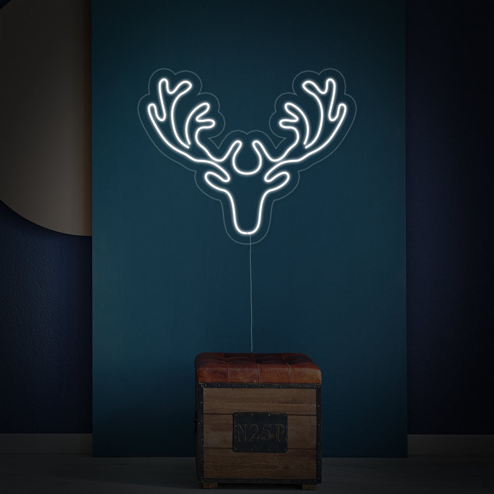 Detailed shot of the deer neon sign design, showing the tubing mounted on a clear acrylic background.