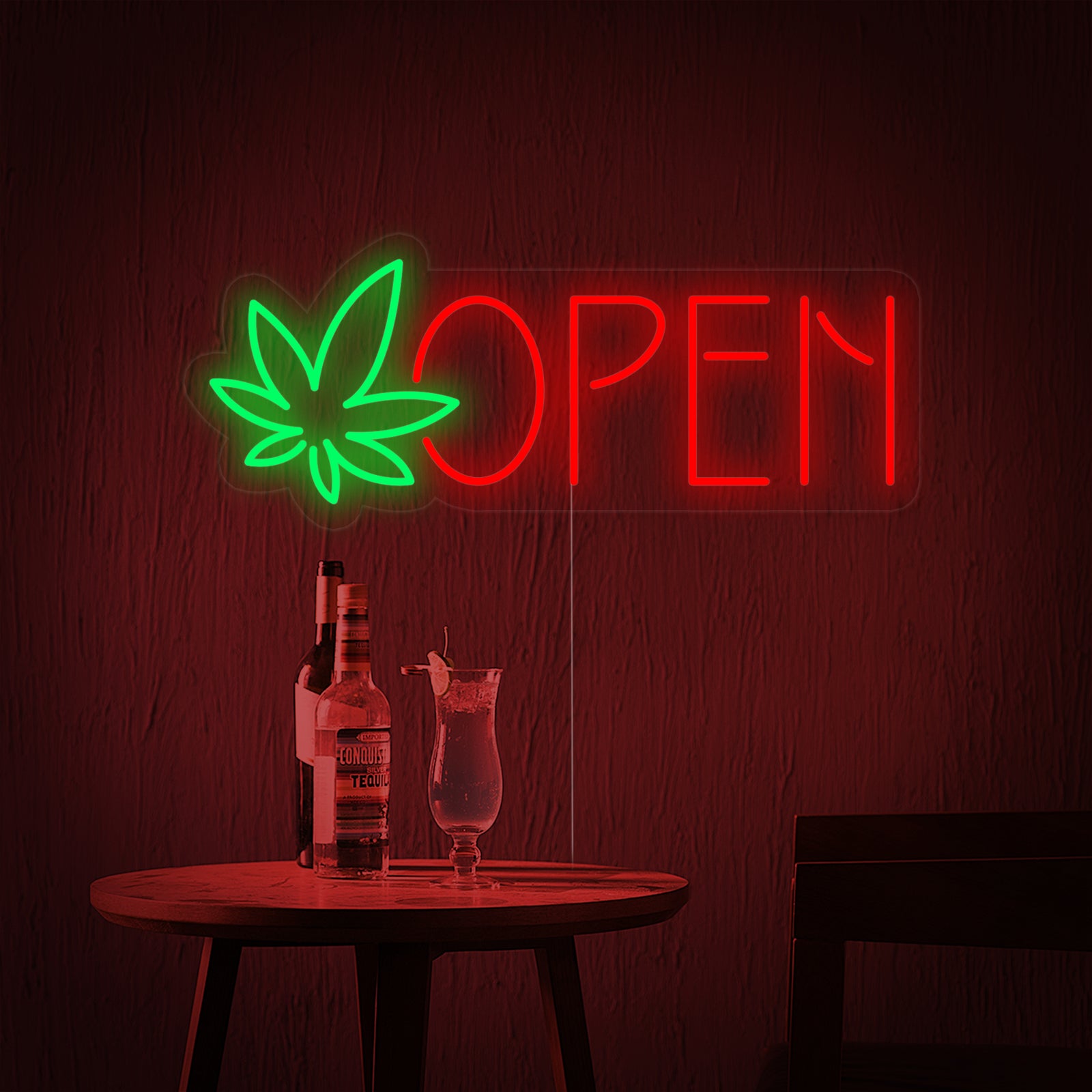 Illuminated dispensary open neon sign featuring a green marijuana leaf over white letters against a rustic, exposed brick wall interior, viewed close-up.