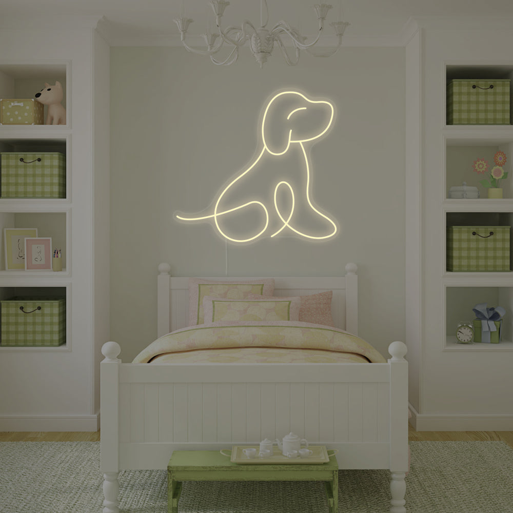 Dog Puppy Neon Sign illuminated on a dark wall.