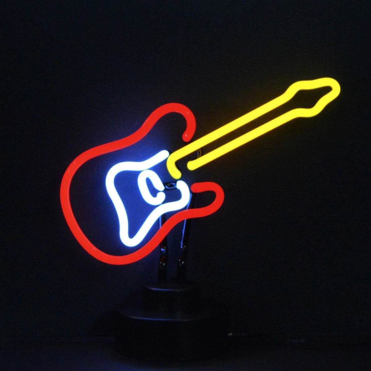 A handcrafted neon sign shaped like an electric guitar, glowing brightly on a black table stand.