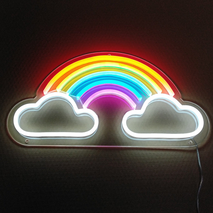 A vibrant "Element Symbol Rainbow" neon sign mounted on a white wall, glowing with multiple colors and showing the power cord and clear acrylic backing.