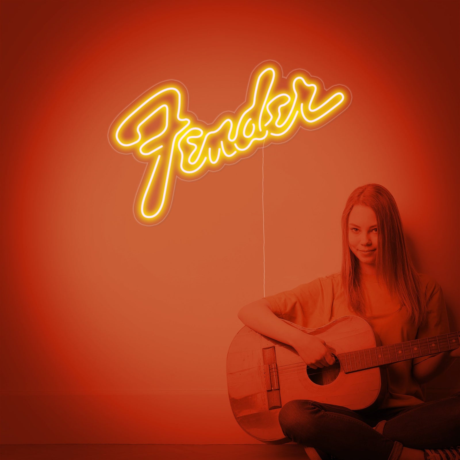 Close-up detail of the Fender logo rendered as a glowing neon sign