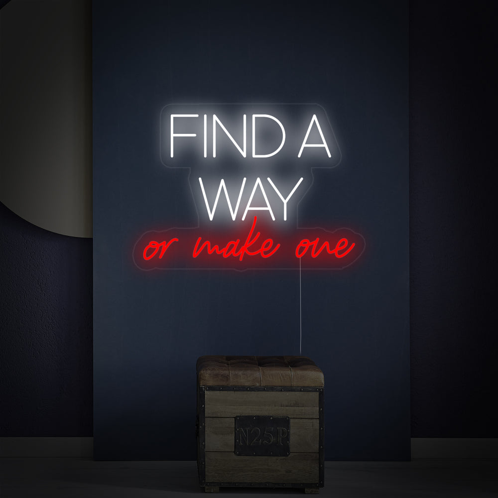 A close-up view of the 'Find A Way Or Make One' neon sign glowing, revealing the transparent acrylic backing and neat installation on a smooth wall.