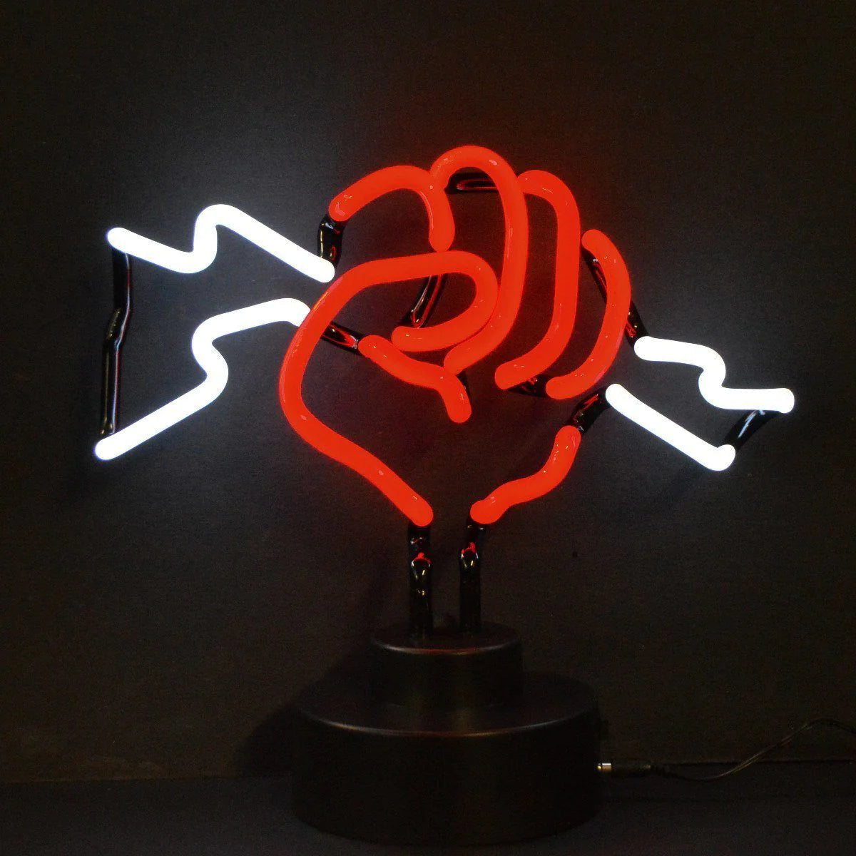Glass neon table sign featuring a glowing fist clenching a lightning bolt, sitting on a base with a power cord