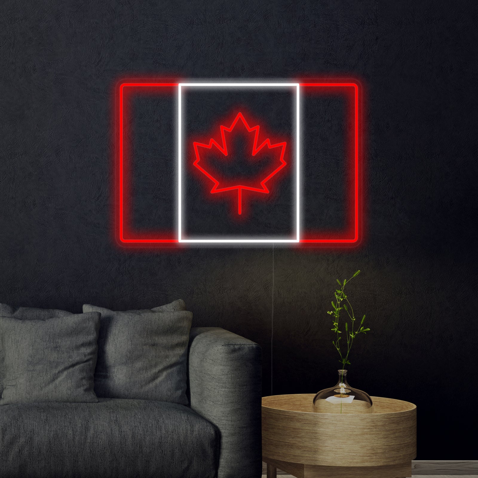 A glowing Flag of Canada neon sign featuring the iconic maple leaf design.