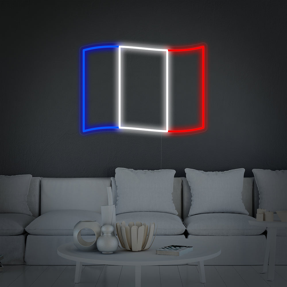 A detailed product shot of the 'Flag of France' neon sign rendered in a clean, contemporary room.