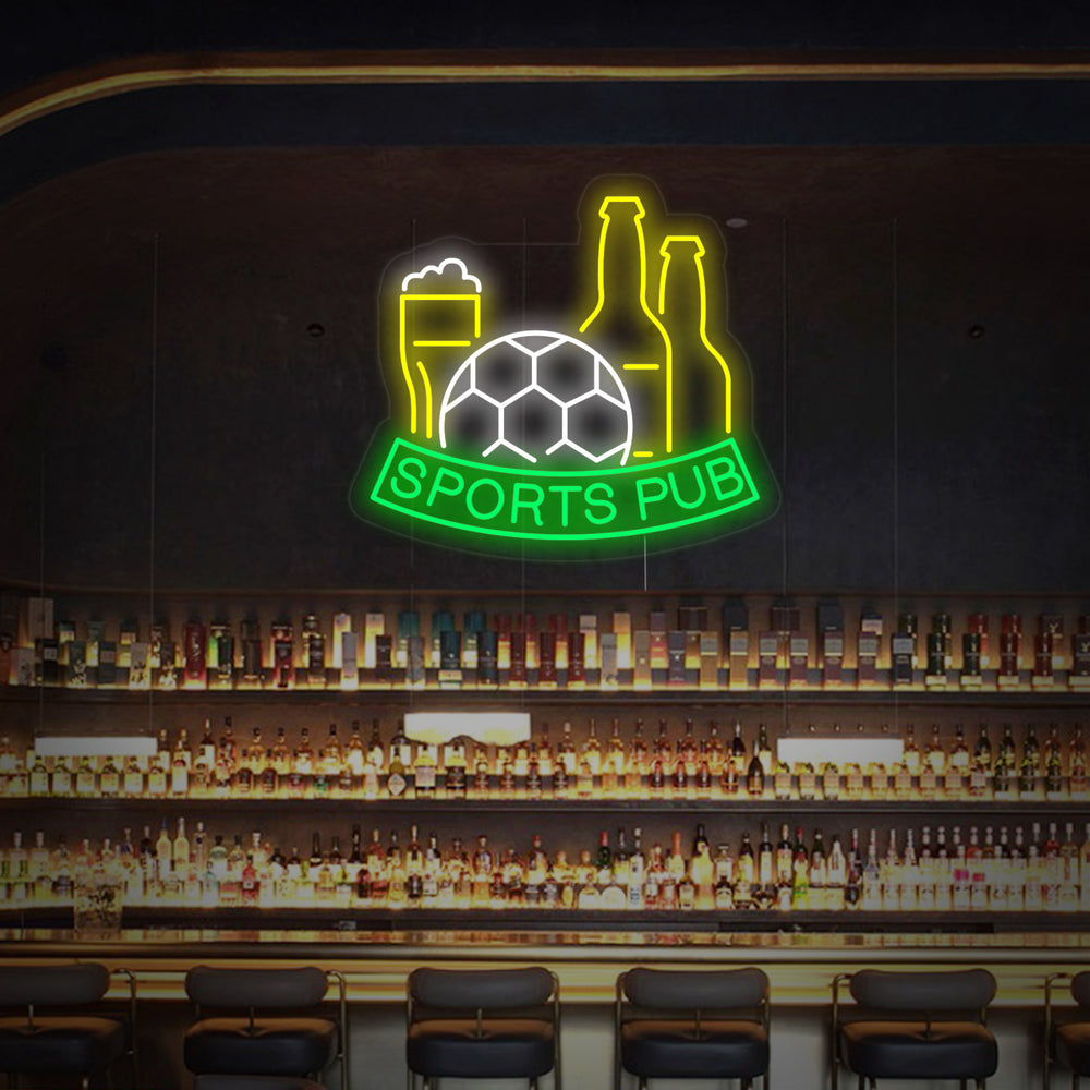 A glowing Football Beer Sports Pub neon sign design over a blurred background of a traditional wood-paneled bar interior.