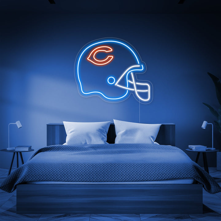 A rendered illustration of a football helmet shaped neon sign with red and yellow tubes glowing on a dark background.