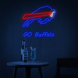Close-up of a blue charging buffalo neon sign on a clear mounting board.