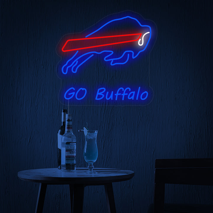 Close-up of a blue charging buffalo neon sign on a clear mounting board.