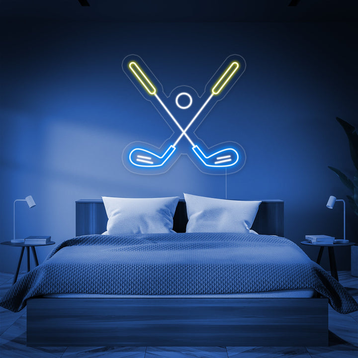Golf ball on a tee with a golf club neon sign illuminating a bedroom wall.