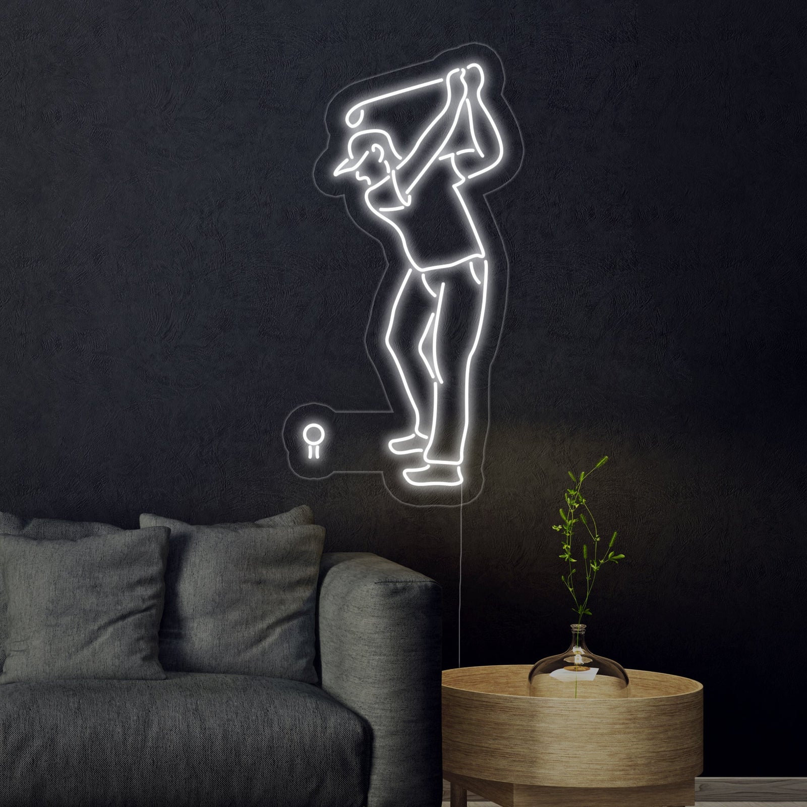 A rendered graphic illustration of a glowing blue and white neon sign featuring a dynamic golfer silhouette mid-swing, set against a dark, circular panel with a stylized target pattern.