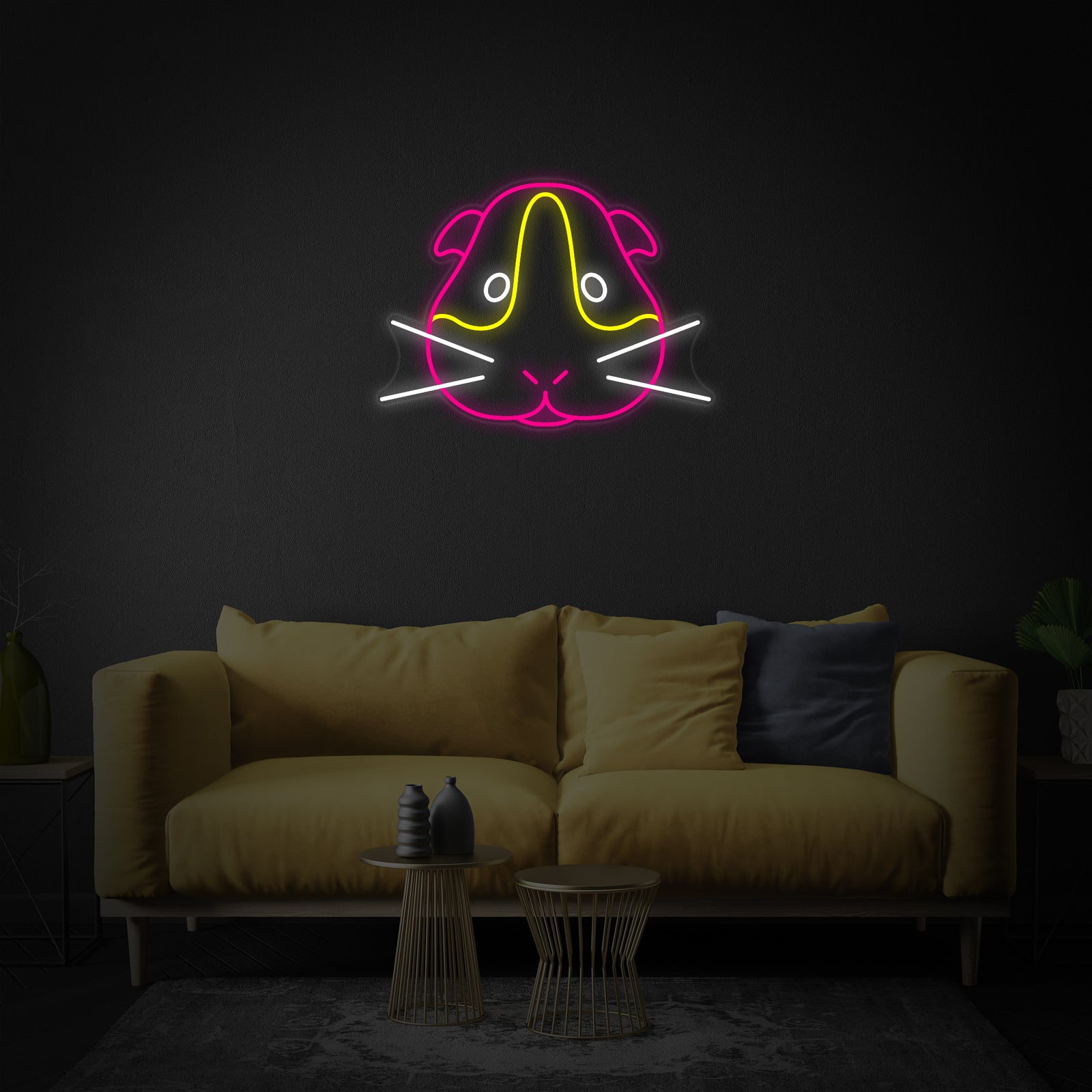 The clean design of the Guinea Pig neon sign with visible acrylic backing, illuminated against a dark background.