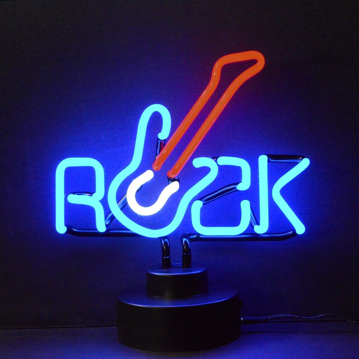 A glowing glass neon table sign featuring a yellow and red electric guitar silhouette with the white text 'Rock & Roll' illuminated next to it, mounted on a small black base and lit against a simple dark grey background.