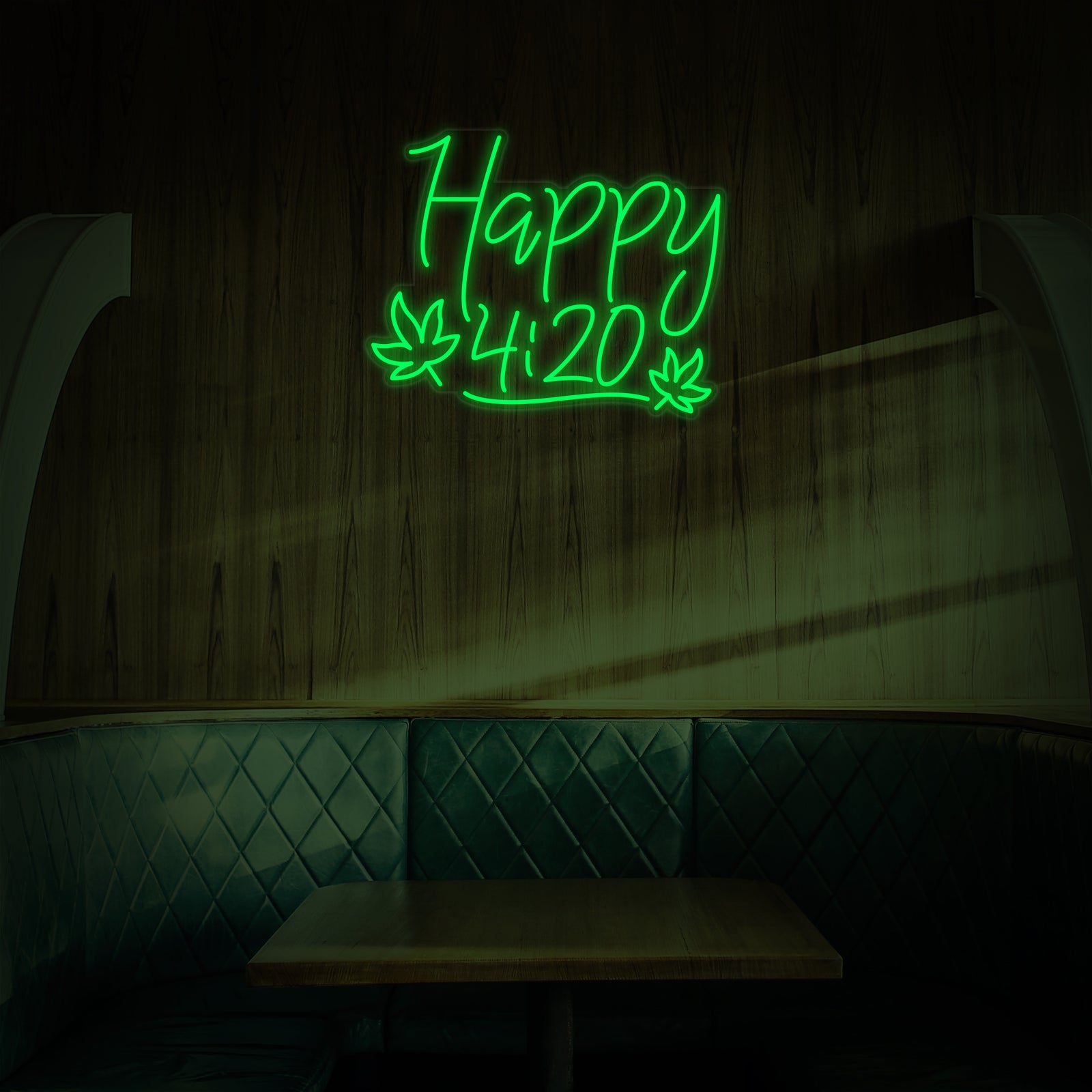 The Happy 420 Marijuana Leaf Cannabis Celebration neon sign graphic displayed as wall decor above a diner booth.