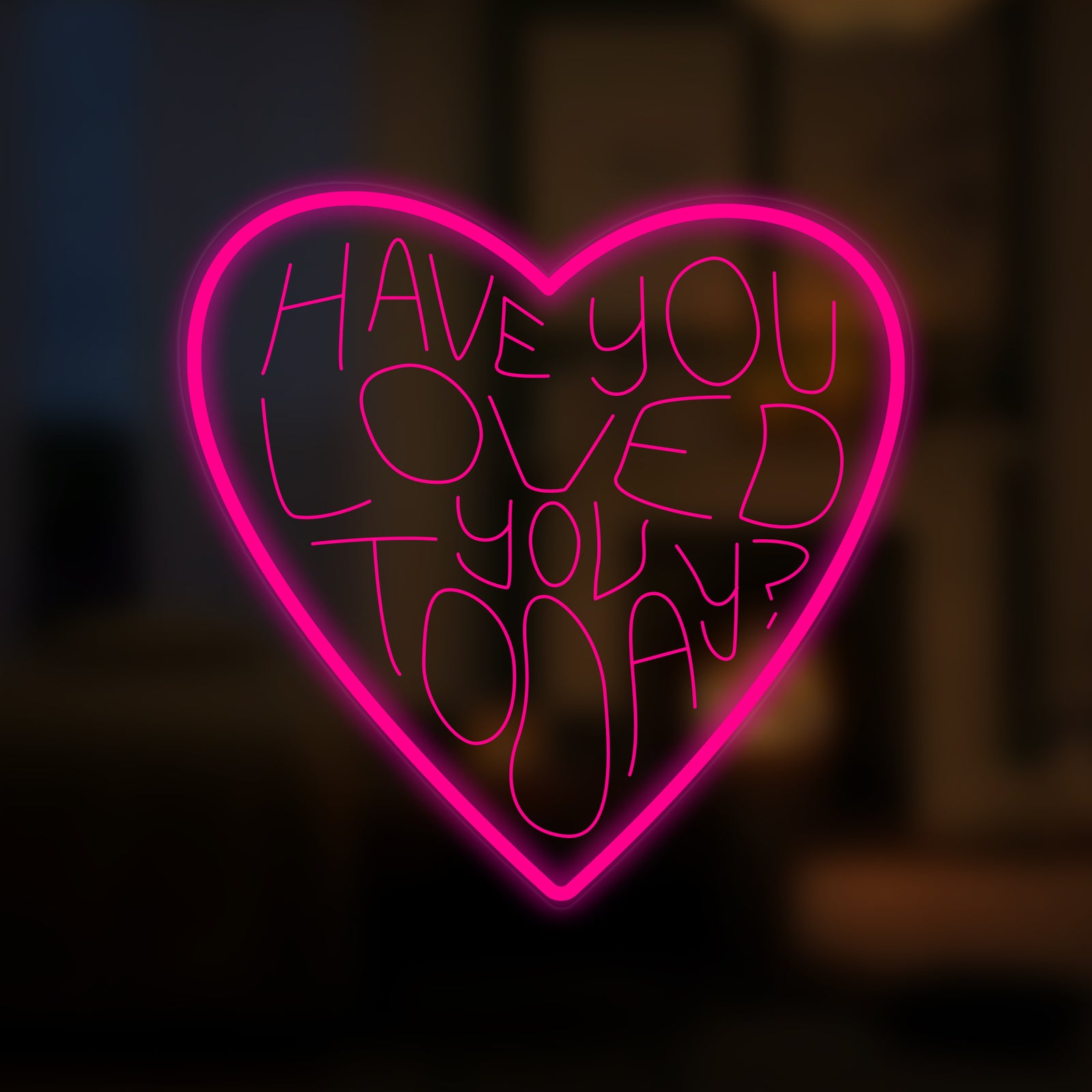 A glowing 'Have You Loved You Today' neon sign in soft white script and an orange heart against an out-of-focus background.